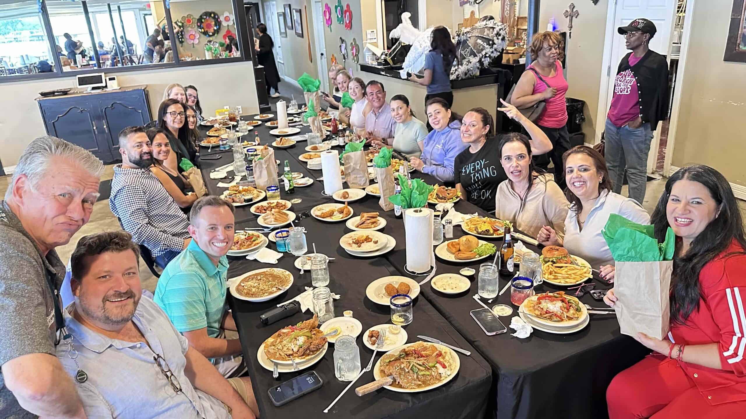Diverse group enjoying a meal at a community event in the U.S.