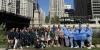 Group of tourists at a city landmark in the Midwest USA.