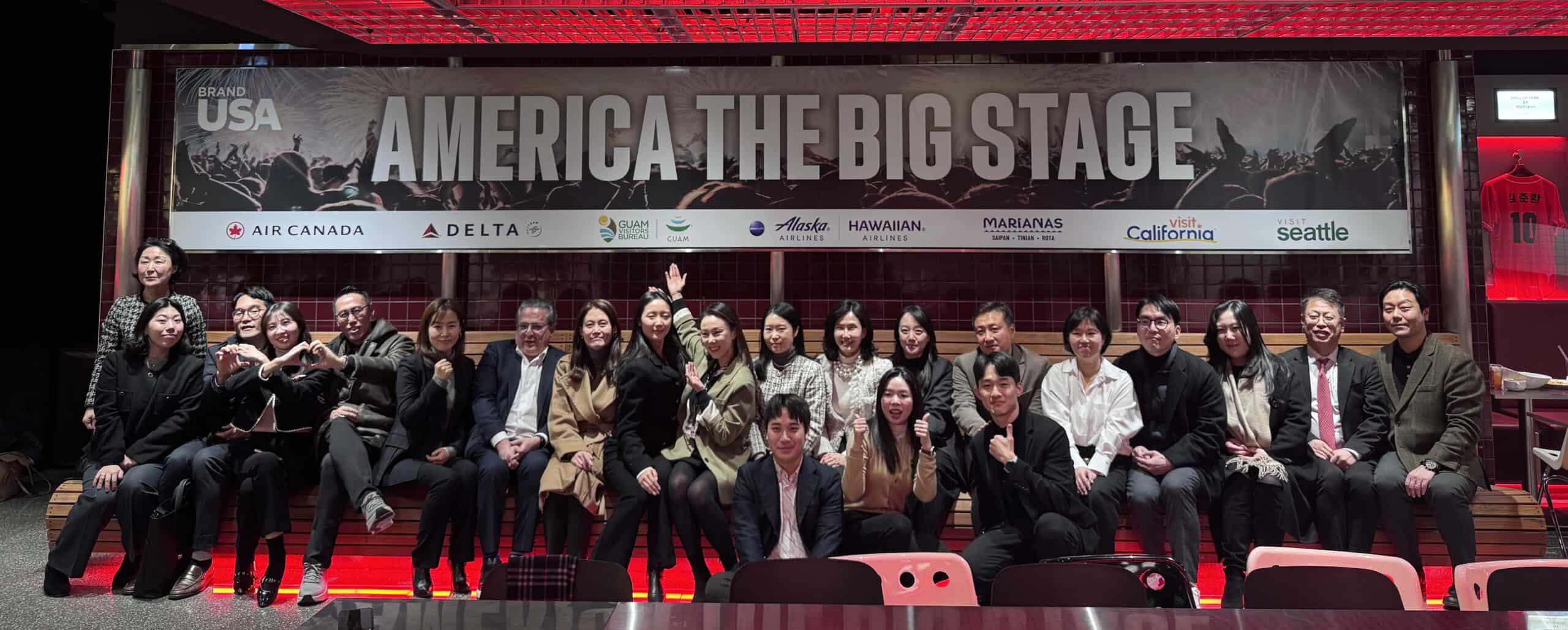 Group photo at Brand USA New Year trade celebration on America The Big Stage.